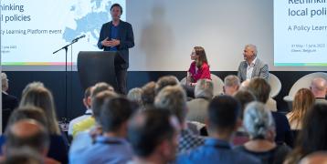 People on stage giving a presentation