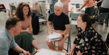 People speaking around a table