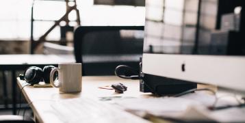 Desk with a computer and a mug 