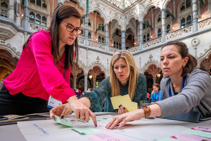 Women working around a table during a communication workshop